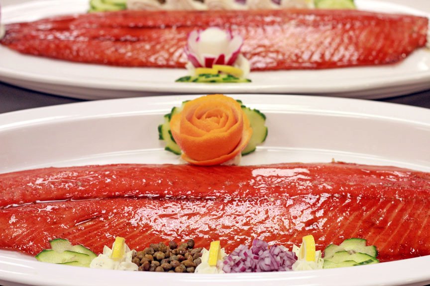 Smoked Salmon Presentation served with cucumber dill sauce, capers, red onion, lemon garnish